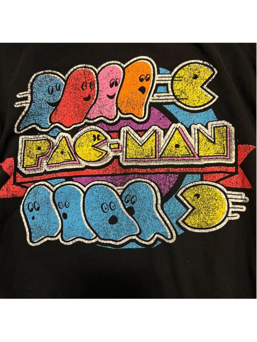 Retro Pac-Man graphic tee featuring colorful ghosts and distressed arcade-style